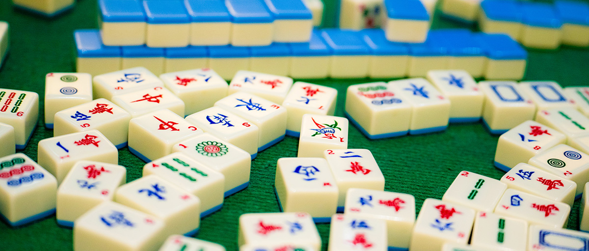 mahjong tiles on green felt table